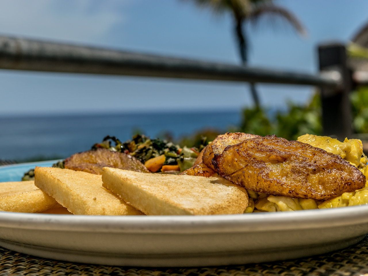 Local Caribbean food with ocean view in Grand Cayman